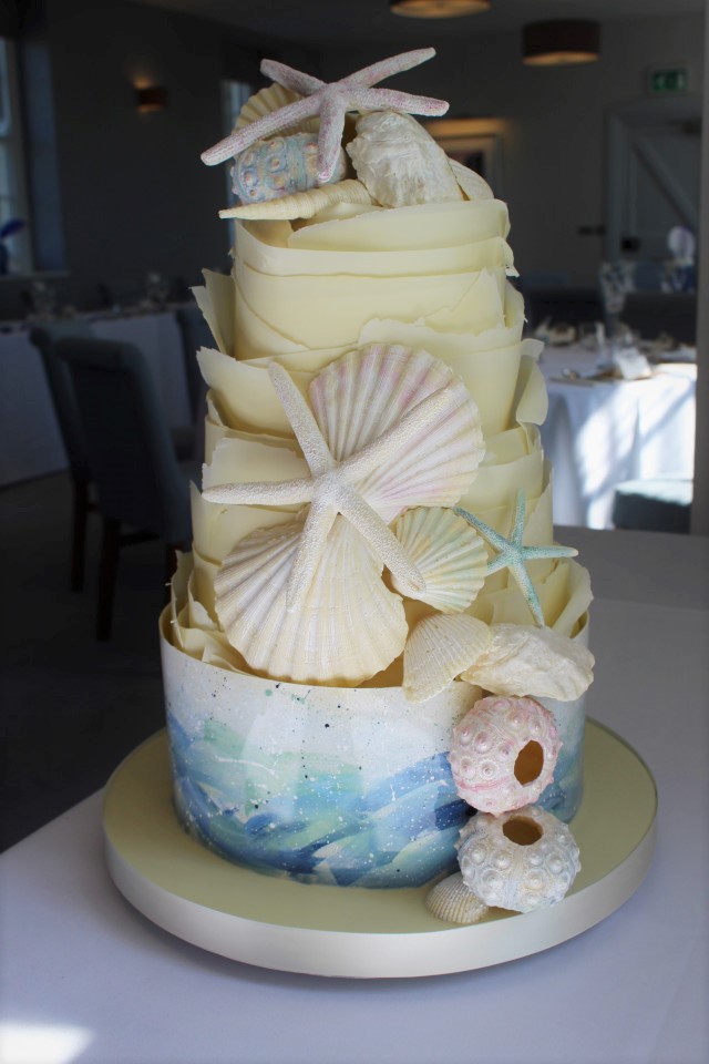 Chcolate sea theme painted wrap and shell wedding cake