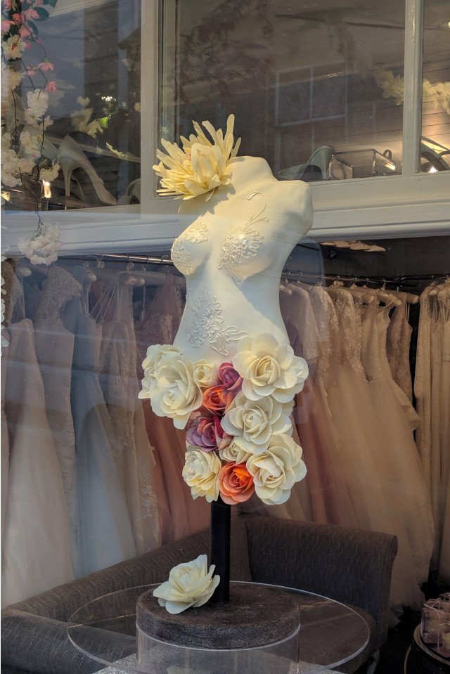 Bridal botique chocolate torso window display