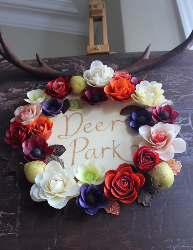 Solid chocolate flowers and antlers sign