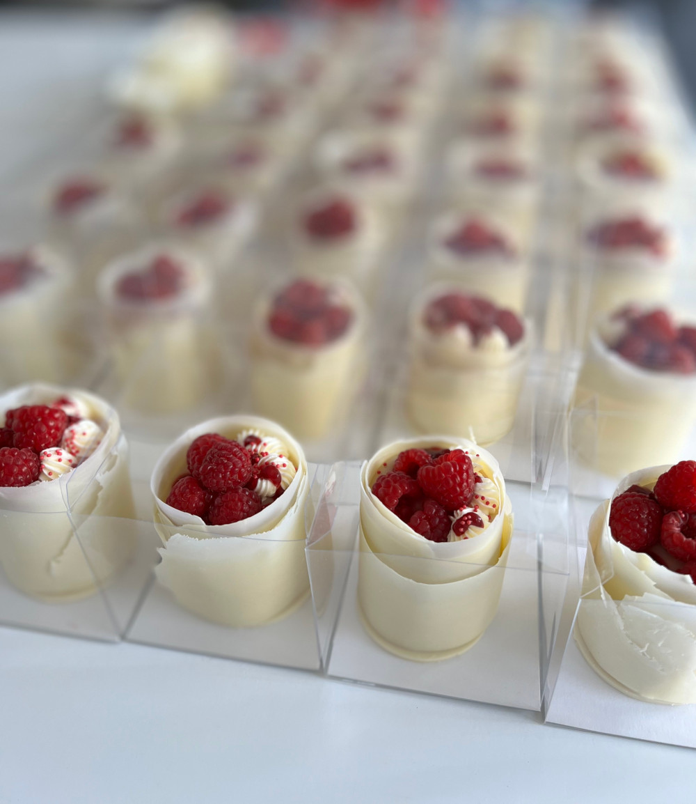 White chocolate wrapped individual vanilla and raspberry gift cakes