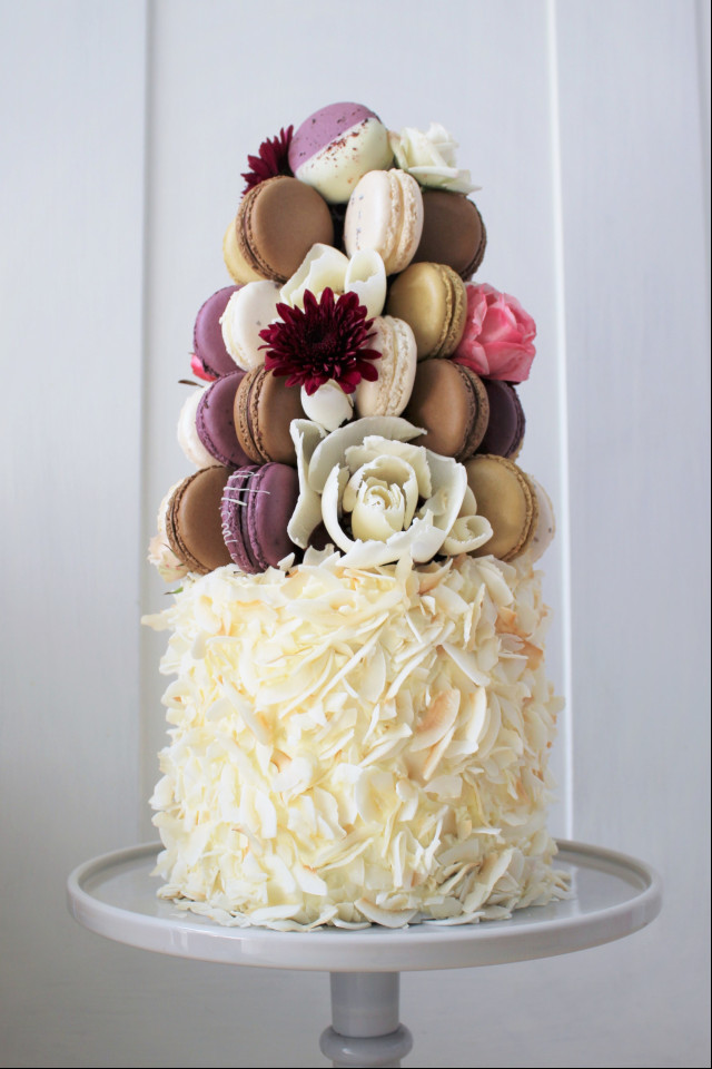 Macaron tower set on coconut cake