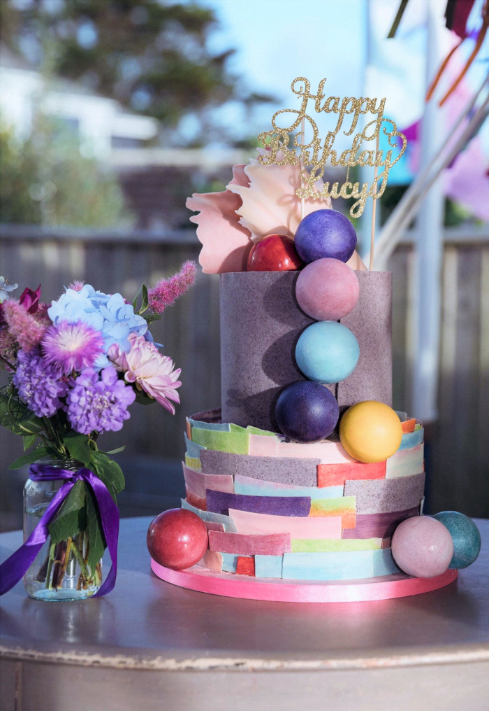Chocolate pom pom & bunting birthday cake