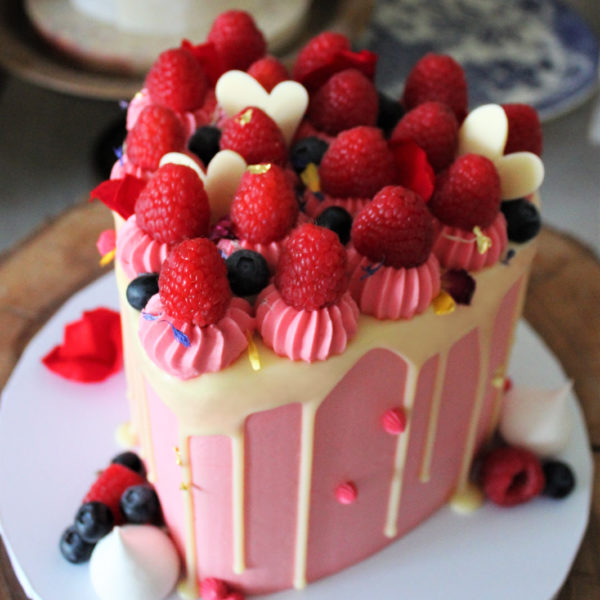Raspberry drip heart chocolate cake from the side