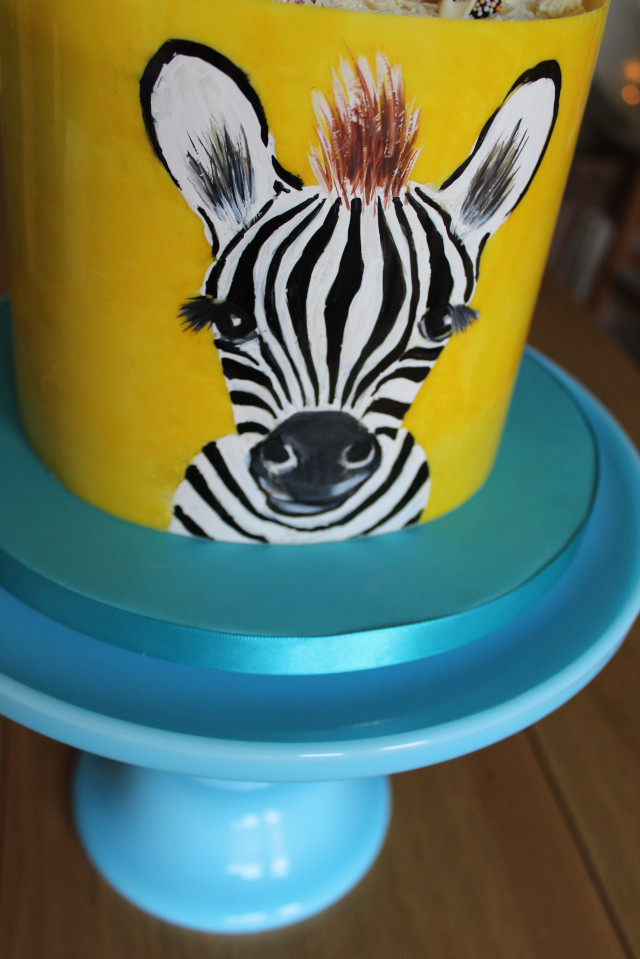 Yellow painted zebra first birthdaycake